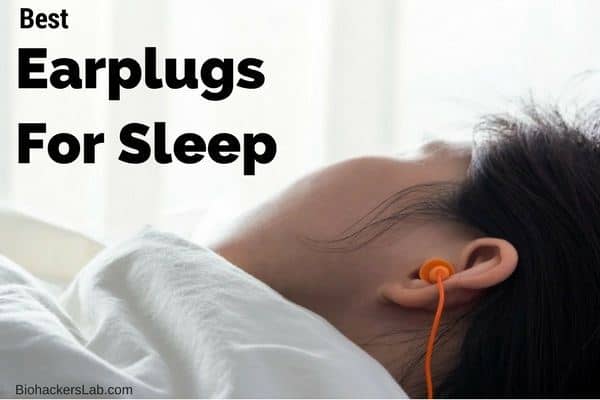 Man sleeping in bed with an orange earplug in his left ear