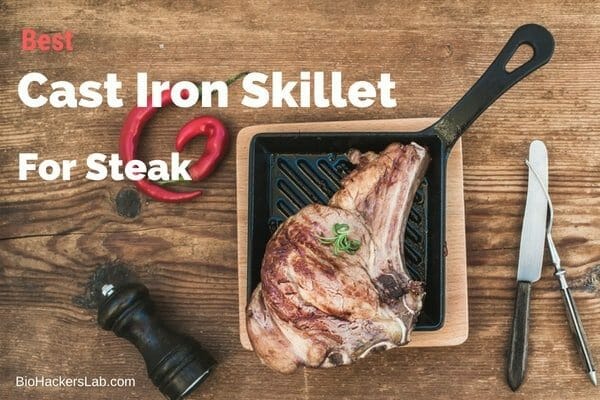 Square cast iron skillet with a piece of t-bone steak on it and knife and fork around it