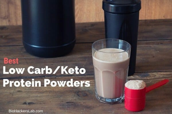 Glass of chocolate protein powder drink with protein bottles and scoop