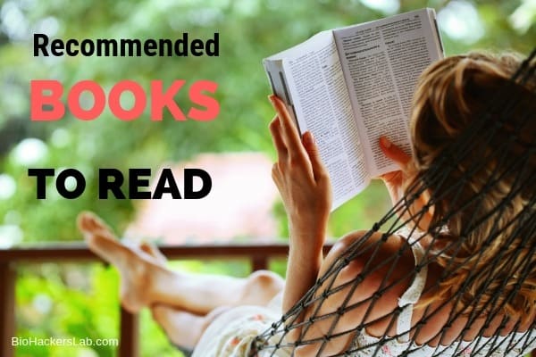 Lady laying in a hammock reading a book