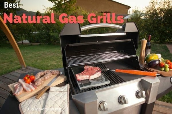 Outside gas grill with lid open and food being displayed